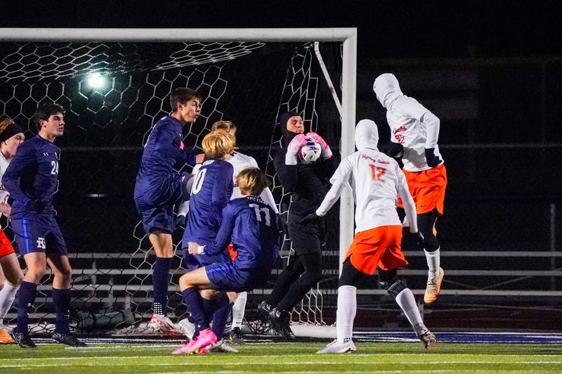St. Charles East's Jordan Rolon (85) makes a save against New Trier during the class 3A St. Charles North Boys Soccer Supersectional match at St. Charles North High School on Wednesday, Nov. 1, 2023.
