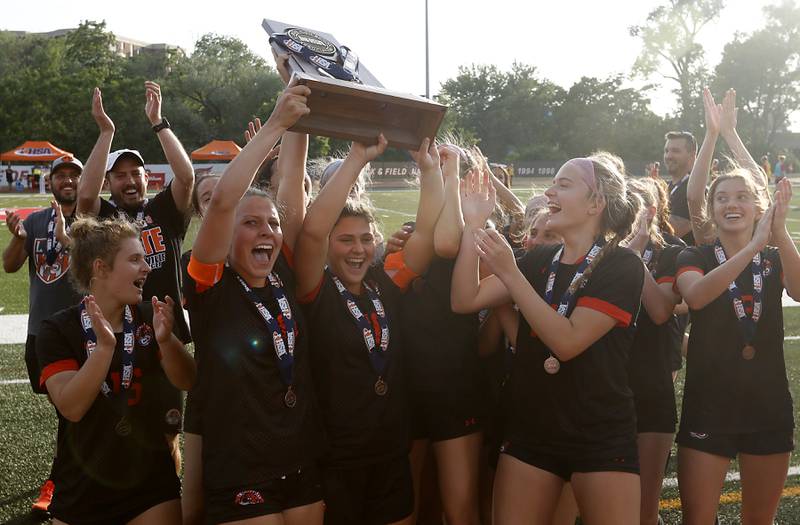 Libertyville celebrates their third-place finish in the IHSA Class 3A state third-place match against  Lincoln-Way East at North Central College in Naperville on Saturday, June 3, 2023.
