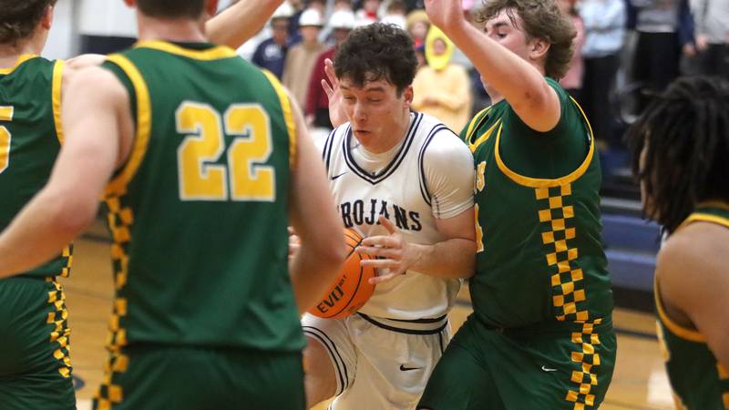 Cary-Grove’s Brady Bauer battles through heavy traffic against Crystal Lake South in varsity boys basketball on Wednesday, Dec. 3, 2025, at Cary-Grove High School in Cary.