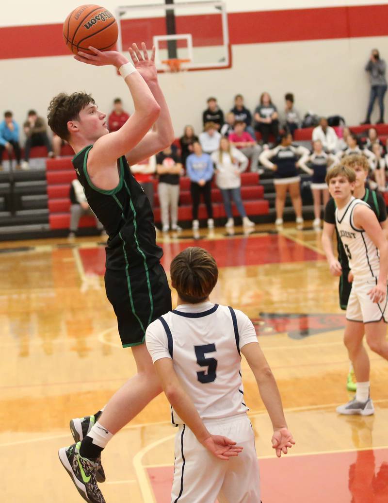 Rock Falls's Ryken Howard eyes the hoop over Fieldcrest's Connor Reichman during the 49th annual Colmone Classic on Satruday, Dec. 9, 2023 at Hall High School.