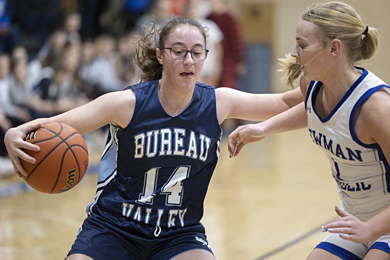Bureau Valley’s Lynzie Cady works against Newman’s Jess Johns Thursday, Nov. 30, 2023 in Sterling.