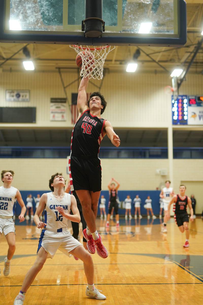 Batavia’s C.J. Valente (40) goes up for a dunk against Geneva’s Cole Engebretson (12) during a basketball game at Geneva High School on Friday, Dec 15, 2023.