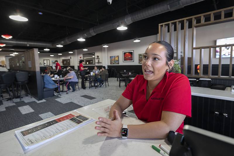Hostess Ella Atilano talks about the decor at Artisan Oven on Thursday, March 19, 2026. The new restaurant held a soft opening on Monday.