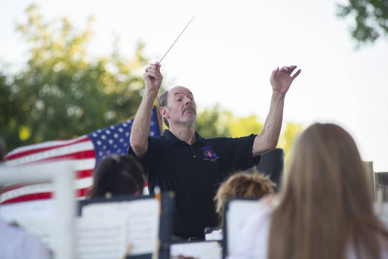 Conductor Jon James leads his band through George Kenny’s “Coat of Arms” to start the show Thursday, June 16, 2022 of the Dixon Municipal Band.
