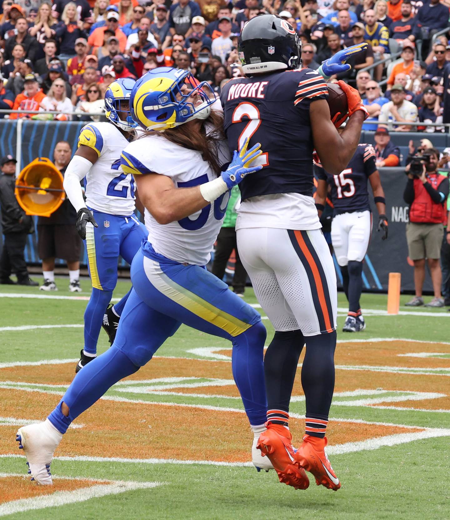 Chicago Bears wide receiver DJ Moore catches a touchdown pass behind Los Angeles Rams linebacker Christian Rozeboom during their game Sunday, Sept. 29, 2024, at Soldier Field in Chicago.