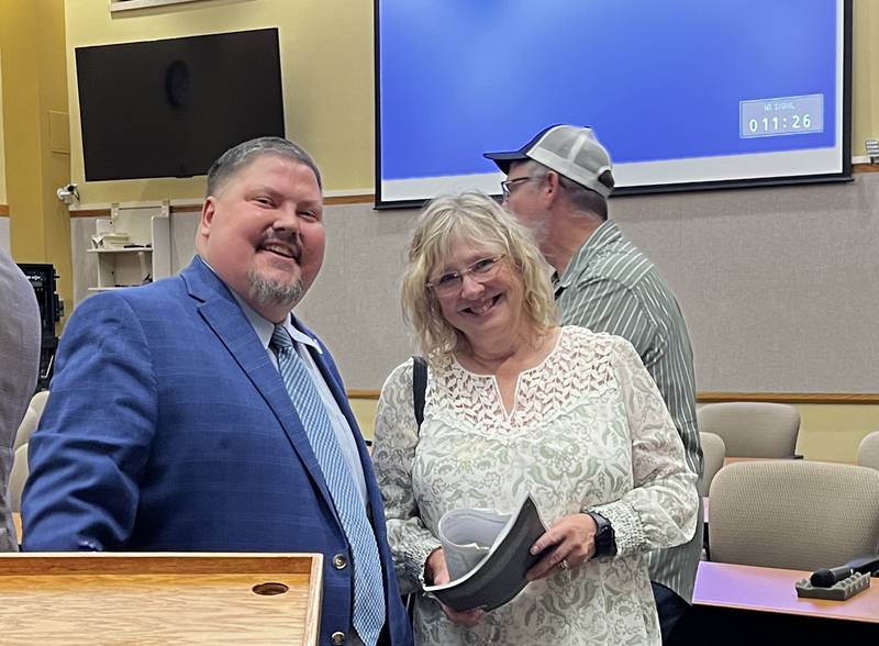 Interim DeKalb County Administrator Derek Hiland and DeKalb County Board member Maureen Little, a Republican from District 1, stand together after a County Board meeting on Aug. 21, 2024.