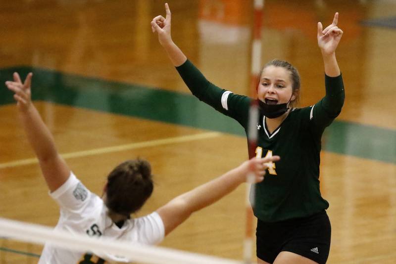 Crystal Lake South libero Alyssa Zagroba, left, and Jessie Proszenyak celebrate a point against Woodstock North