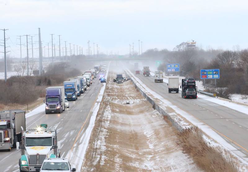 Police respond to the scene of an accident involving a semi truck and two vehicles in the medianof the eastbound lane near mile post 81 on Interstate 80 on Wednesday, Jan .14, 2026 near Utica. Multiple semi tractor trailers were reported in the median between Utica and Ottawa. Interstate 80 remained closed while crews could remove the wreckage from the accident scenes. The crashes happened shortly before 8:30a.m. A fast moving squall line with gusty winds and snow near white-out conditions caused the wrecks.