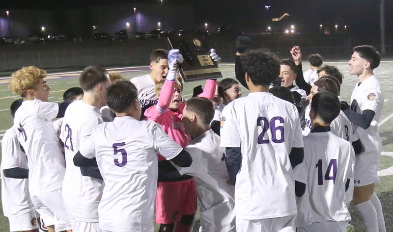 Members of the Mendota boys soccer team hoist the Class 1A Supersectional plaque after defeating Quincy Notre Dame during the Class 1A Supersectional game on Monday, Nov. 3, 2025 at Mendota High School.