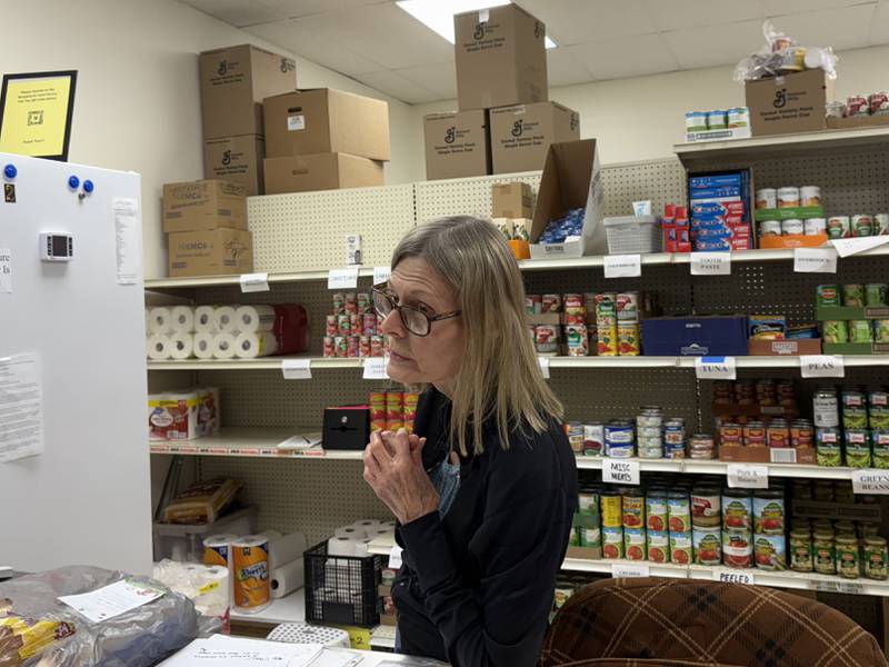 Woodstock Food Pantry volunteer Pat Tiger helps someone at the food pantry Oct. 31, 2025.