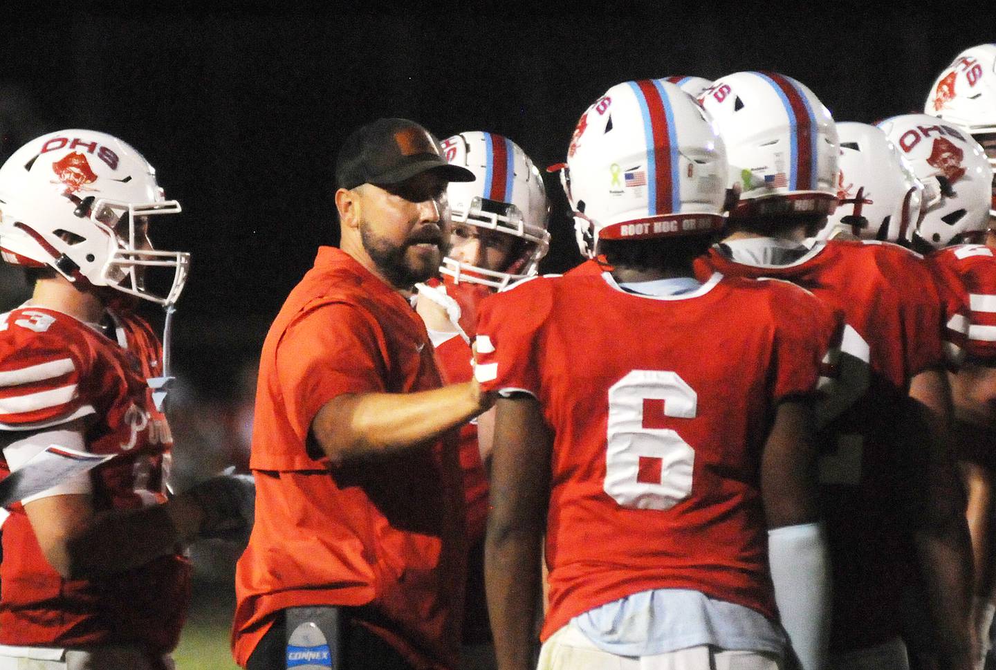 Ottawa head coach Chad Gross talks with his players at King Field on Friday, Sept. 1, 2023.