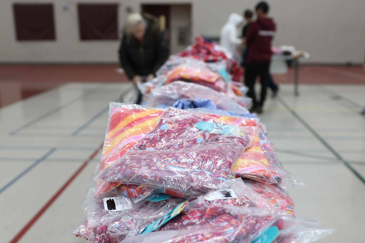 A pile of clothing sit on a table at ShareFest at Lockport Township High School East campus on Sunday, Dec. 15, 2024.