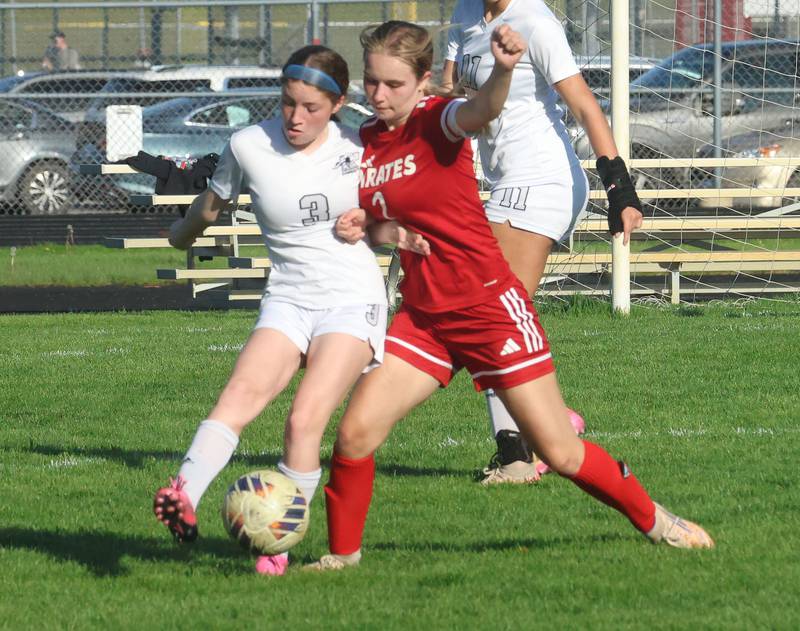Kaneland's Arden Stoddard and Ottawa's Chloe Carmona battle for the ball on Wednesday, April 22, 2026 on King Field at Ottawa High School.