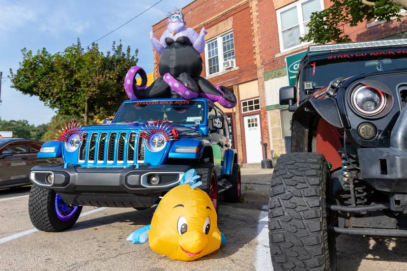 Jeep with Disney characters sits at the 20th annual Cruise Night on Friday, August 8, 2025, on Main Street in Marseilles.