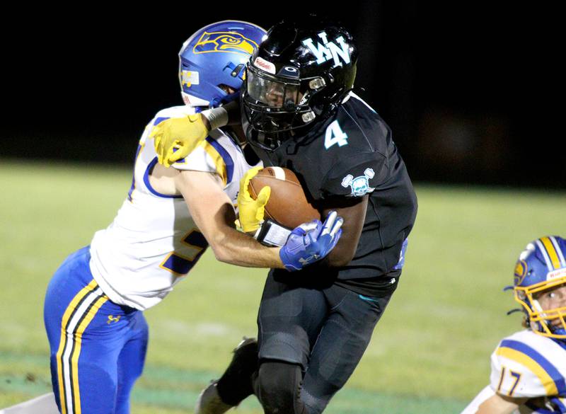 Woodstock North’s Sean Mitchell runs the ball against Johnsburg in varsity football on Friday Sept. 27, 2024, at Woodstock North High School in Woodstock.