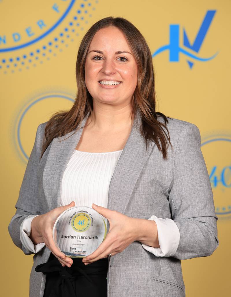 Jordan Harcharik poses with her 40 Under Forty award during the Illinois Valley Chamber of Commerce Champions of Change Awards Night on Thursday, April 10, 2025 at the Westclox Event Center in Peru.