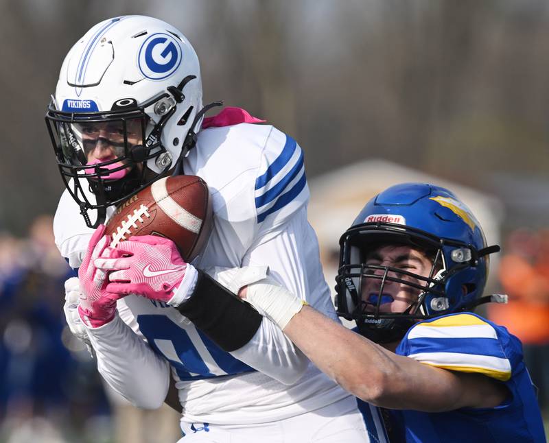 Geneva's Bennett Konkey makes a touchdown reception ahead of Lake Forest's Joey Schnack during the first quarter of their Class 6A football quarterfinal game on Saturday, Nov. 16, 2024, in Lake Forest.