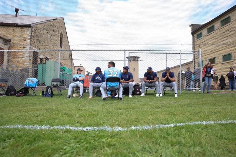 Several Gate Way Grizzle players sit on the field before the Joliet Slammers preseason game at the Old Joliet Prison on Thursday, April 29, 2026 in Joliet.