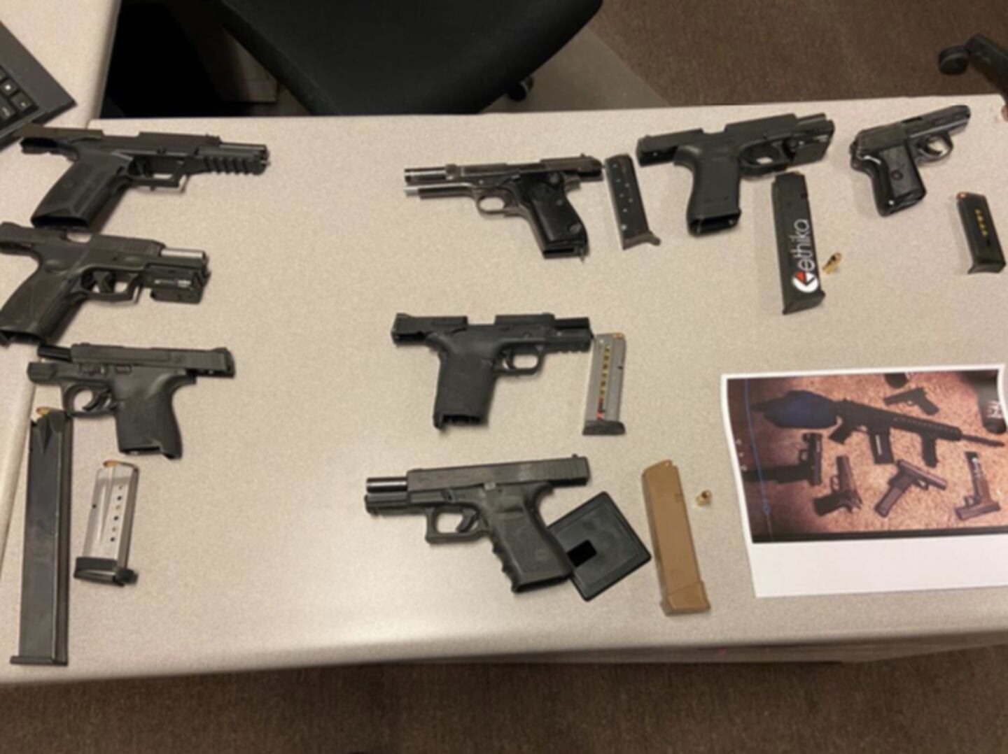 Firearms seized by Joliet police following the arrest of Adrian Bailey, 19, and a 17-year-old male, on Thursday, May 20, 2021.