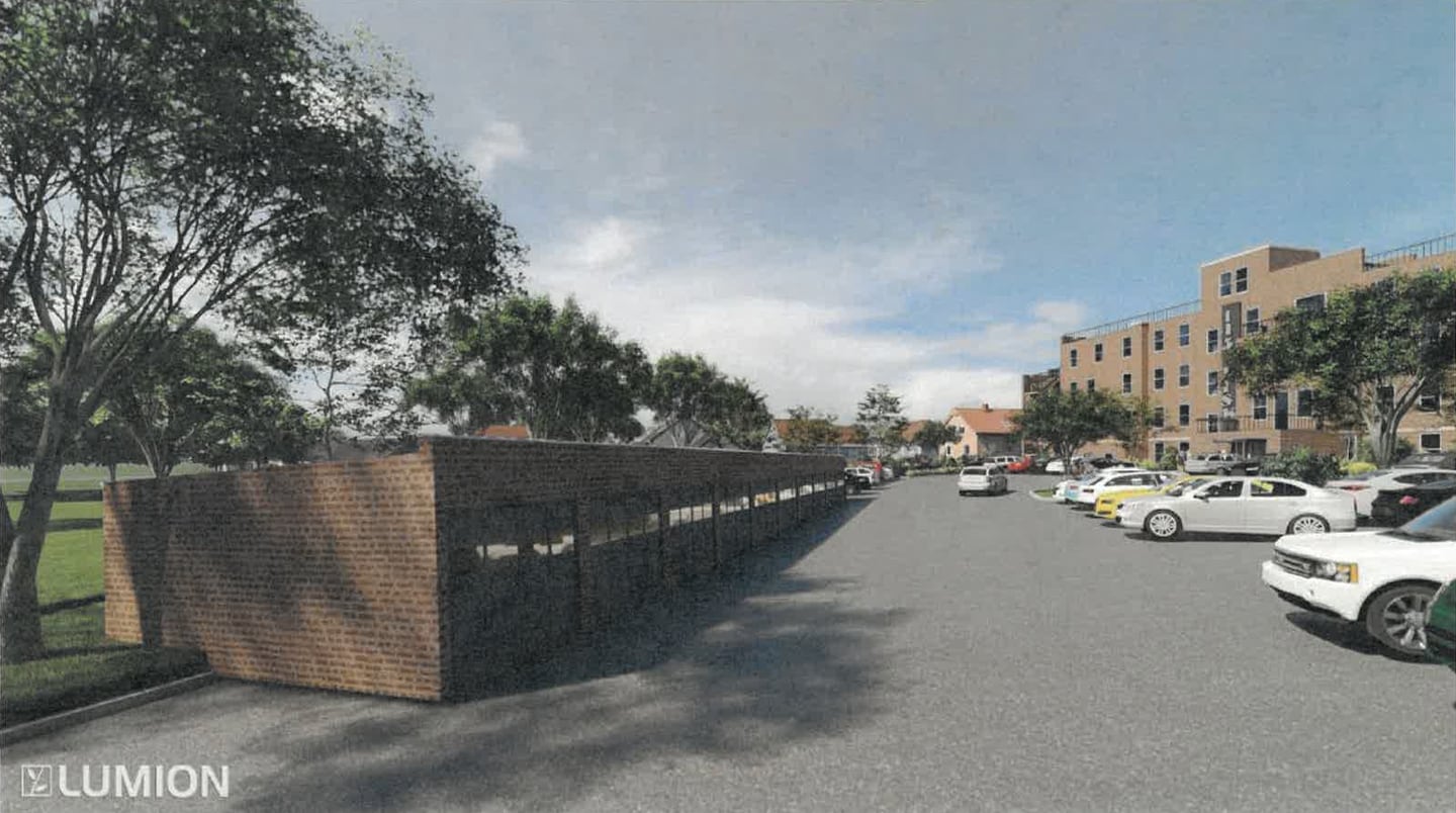 Concept plans show a parking lot with carports outside a proposed 32-unit apartment complex at 145 Fisk Ave. in DeKalb. A developer has proposed the build at the former St. Mary's Hospital.