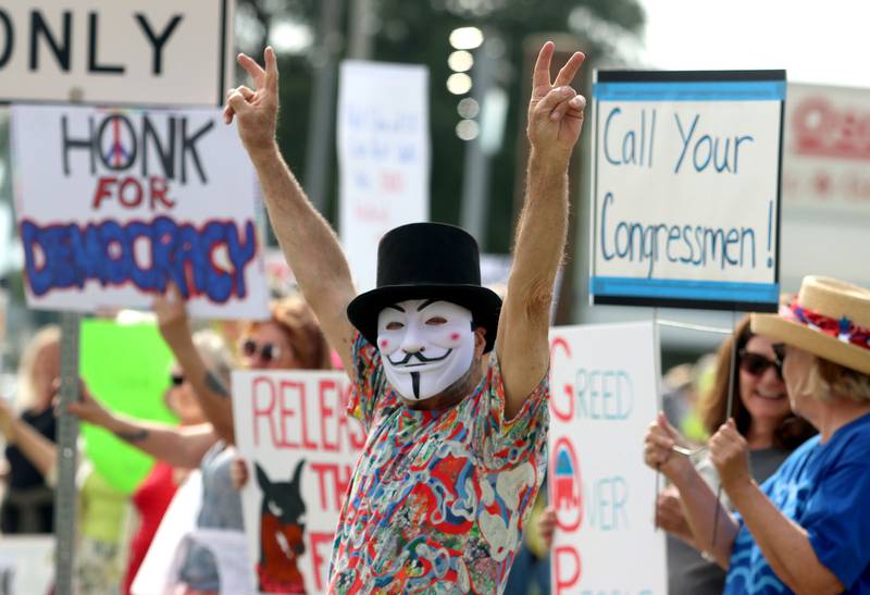 Ronald Orist of Crystal Lake participates during the “Good Trouble Lives On” protest along Route 14 in Crystal Lake on Thursday, July 17, 2025.