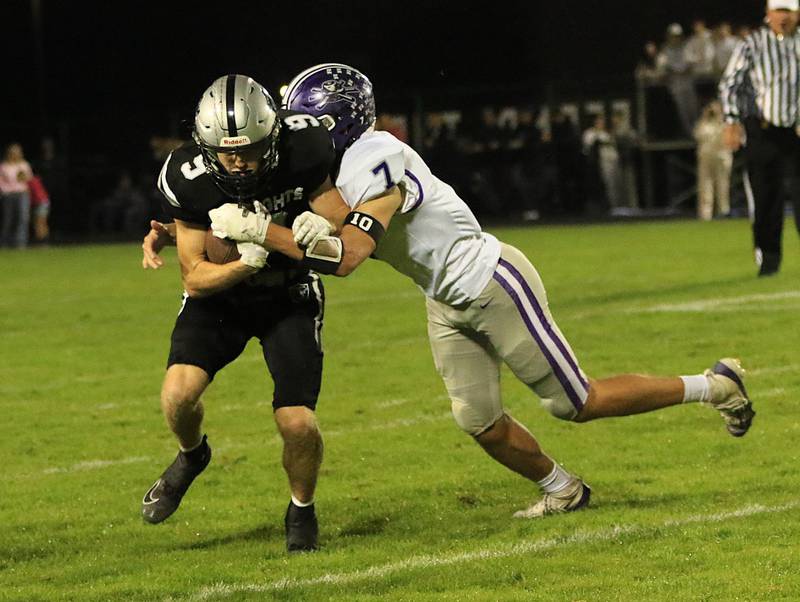 Rochelle's Mark Green tackles a Kaneland player during Friday's game at Kaneland.