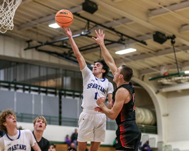 St Francis Niko Quaranta (1) puts up a shot during their Jack Tosh basketball tournament game between St Francis at Yorkville Thursday Dec 26, 2024 in Elmhurst.