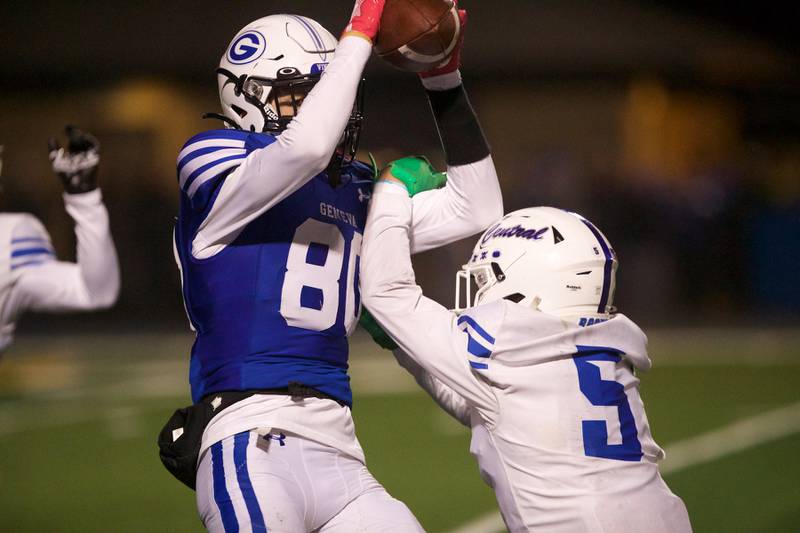 Geneva's Bennett Konkey makes the catch as Burlington Central's LJ Kerr looks to intercept the ball at the Class 6A second-round playoff game on Saturday Nov.9,2024 in Geneva.