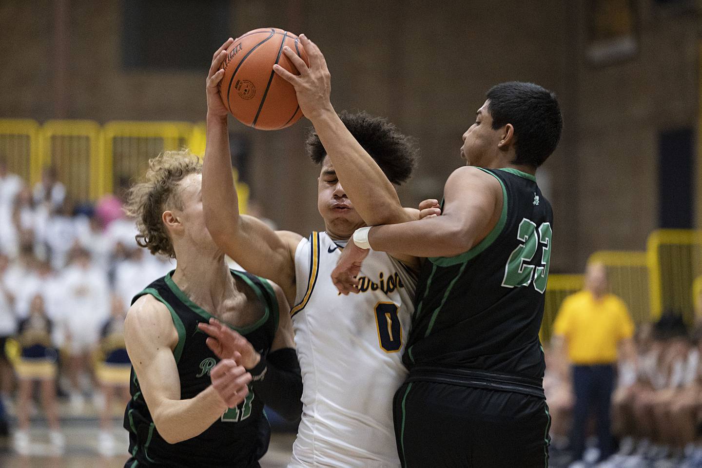 Sterling’s Andre Klaver splits the defense of Rock Falls’ Gavin Sands (left) and Diego Hernandez on Tuesday, Nov. 29, 2022.