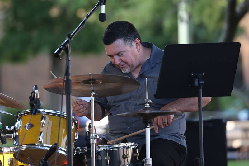 Phil Beale of the Shawn Maxwell Quartet plays drums at the Wine, Jazz and Arts Fest at Bicentennial Park in Joliet on Saturday, Aug. 19, 2023.