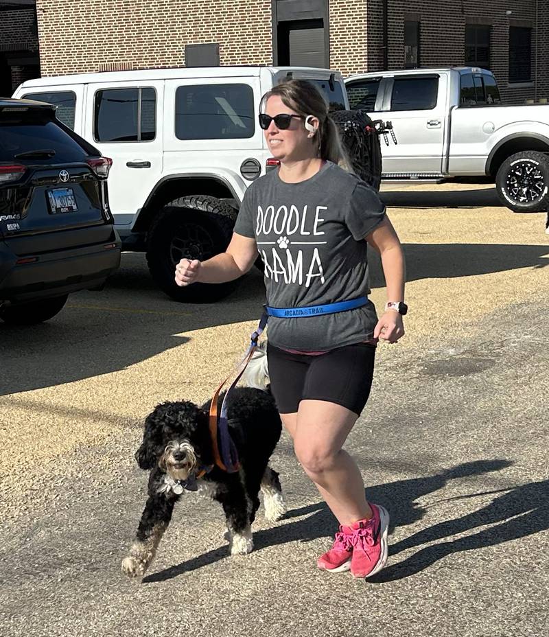 Heidi Miller of Forreston and her dog, Gunner, start the 5K race at the Polo High School’s Doggy Dash on Saturday, Sept. 6, 2025.  While Gunner and Heidi ran the race Gunner's son, 11-week-old Rooster, and his human dad, Jon, took part in the 1-mile walk. The pups also won the costume contest.
