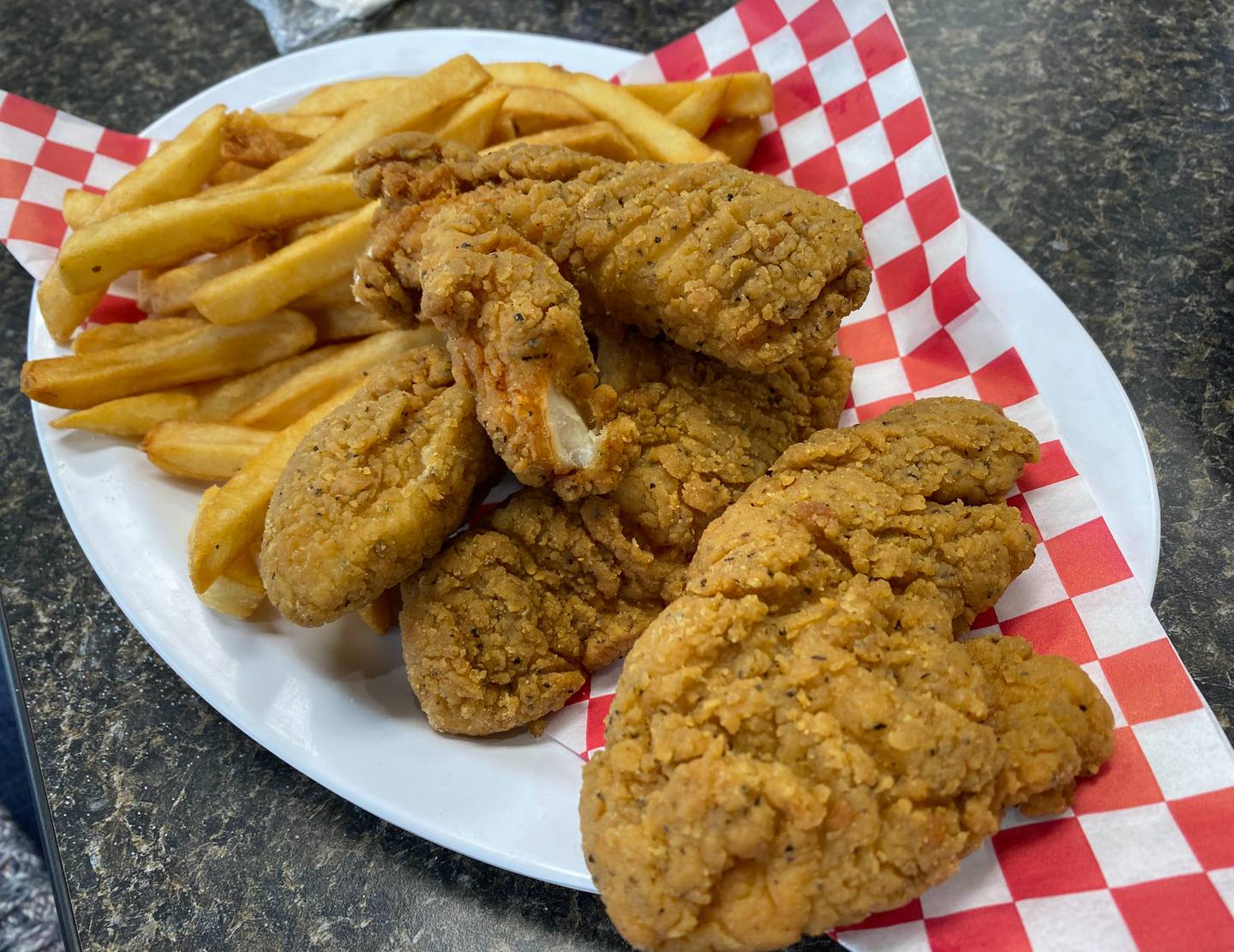 During our visit to Tangie's Kitchen, my fellow diner ordered the chicken tenders with fries.