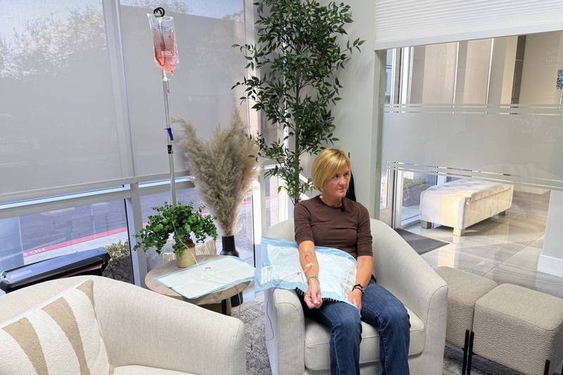 Andrea Steinbrenner receives an IV infusion at Pure Alchemy Wellness, Tuesday, Nov. 11, 2025, in Chula Vista, Calif. (AP Photo/Javier Arciga)