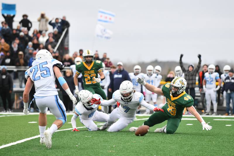 Coal City's Logan Natyshok (49) falls to the ground as DePaul's Nicholas Hathcoat (7) and Avry Bellis force the incomplete pass near the end of the fourth quarter on Saturday, Nov. 23, 2024, during the Coalers' 21-14 loss to the Rams in the IHSA Class 4A Playoffs semifinal game.