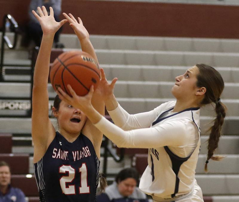 Cary-Grove's Ellie Mjaanes (right) hugs her teammate, Emily Larry, after Cary-Grove lost to St. Viator in a IHSA Class 3A Antioch Sectional semifinal girls basketball game on Tuesday, Feb. 20, 2024, at Antioch High School.