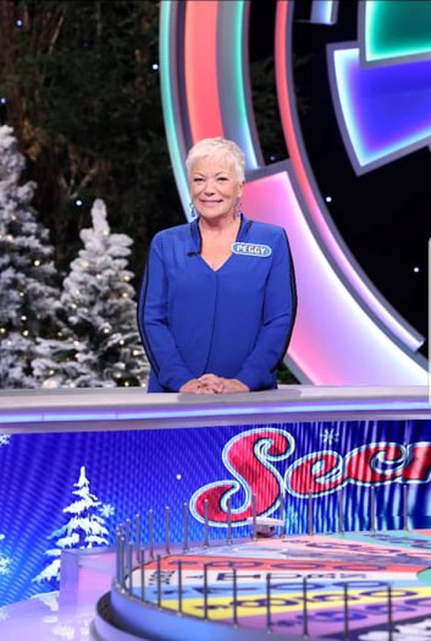 Peggy McEvilly-Reed will appear on a Wheel of Fortune’s “Secret Santa Holiday Giveaway” show at Tuesday, 6:30 p.m., Dec. 14, 2021, on WLS (ABC7). Her mother Ann McEvilly (right, now deceased), was a longtime fan of the show and urged McEvilly-Reed to audition.