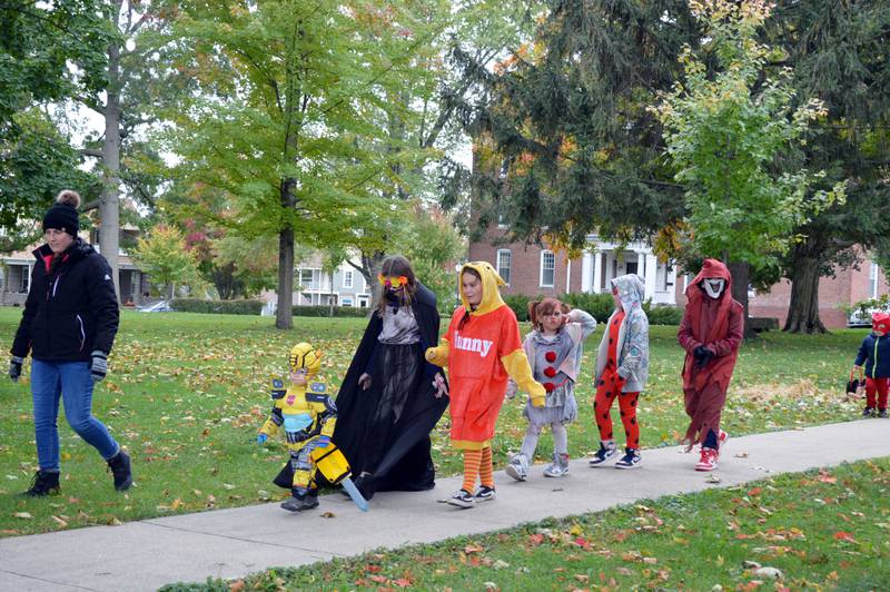 Children participate in a costumed parade during the Family Fall Festival at the Mt. Morris village square on Oct. 16. This was the festival's first year; it serves as an additional fundraiser for the Let Freedom Ring Fourth of July fireworks.
