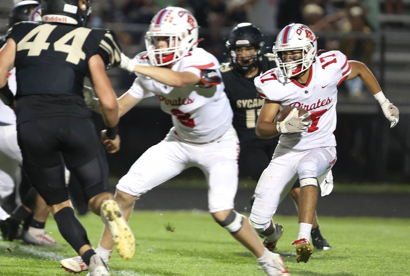 Ottawa's Julian Alexander follows Matt Haerle as he blocks Sycamore's Kyle Prebil during their game Friday, Sept. 16, 2022, at Sycamore High School.