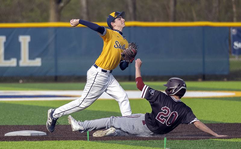 Sterling’s Cale Nettleton fires to first in an attempt to complete a double play while Moline’s Emmanuel Lopez looks to break it up Wednesday, April 16, 2025.