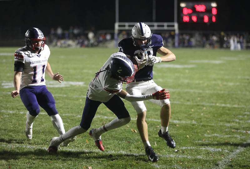 Belvidere North's Antoine Williams tackles Cary-Grove's Lance Moore after Moore ran for a first down during an IHSA Class 5A quarterfinal playoff football game on Friday, November 14, 2025, at Cary-Grove High School, in Cary.