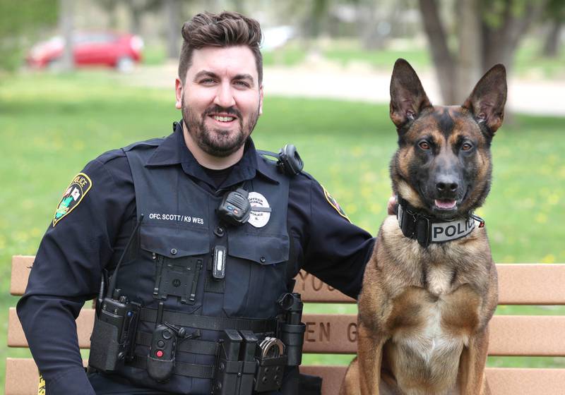 Belgian malinois Wes and his handler Sycamore Police K-9 officer Greyson Scott Thursday, April 18, 2024, at the Sycamore Forest Preserve.