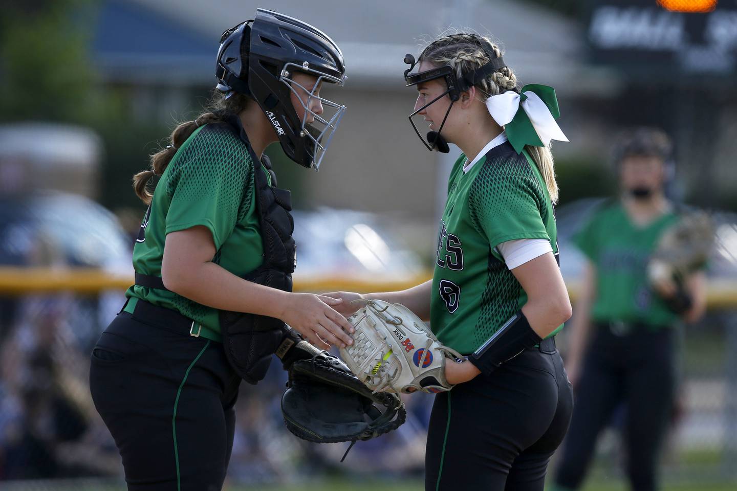 York’s catcher Rena Sotos speaks with pitcher Lauren Derkowski during their softball game against Downers Grove South in Elmhurst on Wednesday, May 26, 2021.