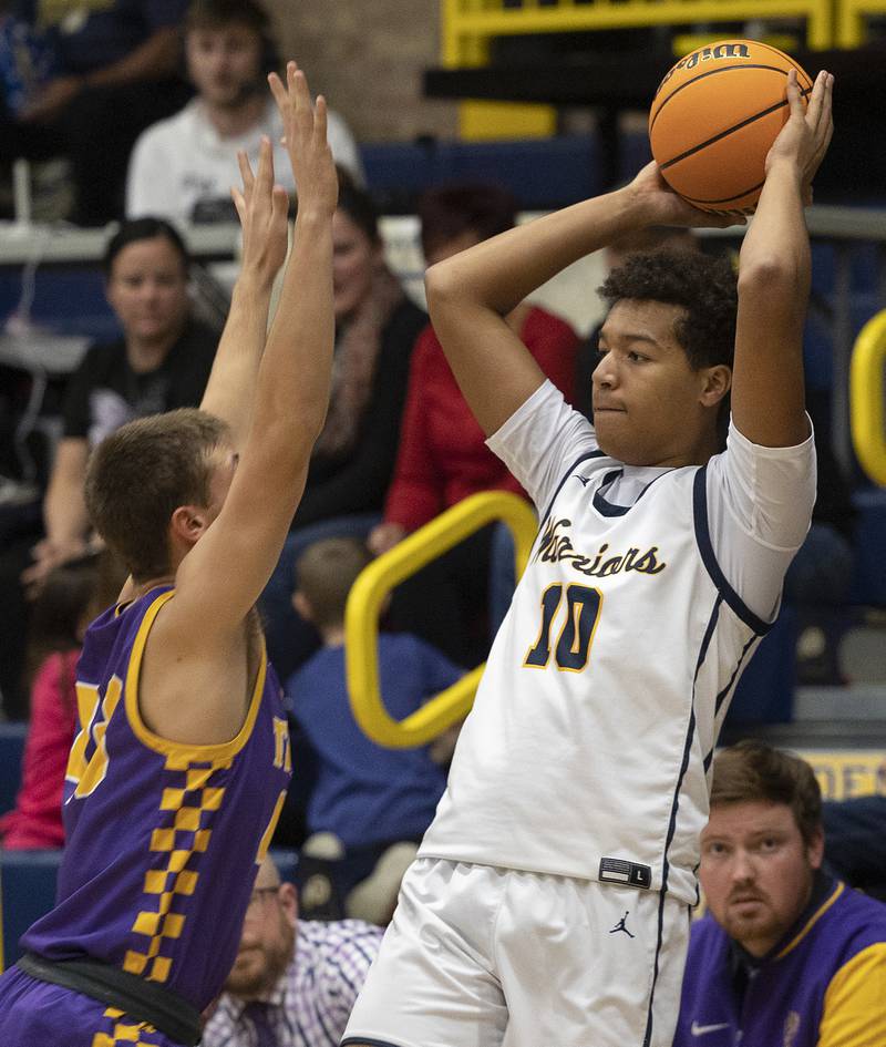 Sterling’s Koby Bell looks to pass against Sherrard’s Brody Bender Monday, Dec. 16, 2024, at Sterling High School.