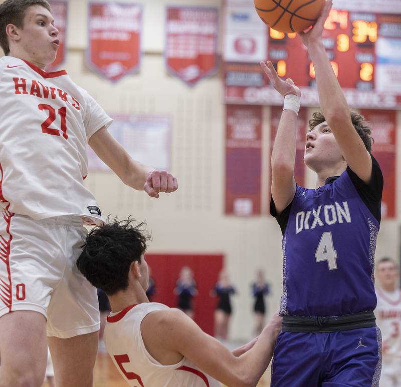 Dixon’s Brody Nicklaus puts up a shot against Oregon’s Tucker O’Brien (left) and Benito Olalde Tuesday, Feb. 4, 2025, in Oregon.