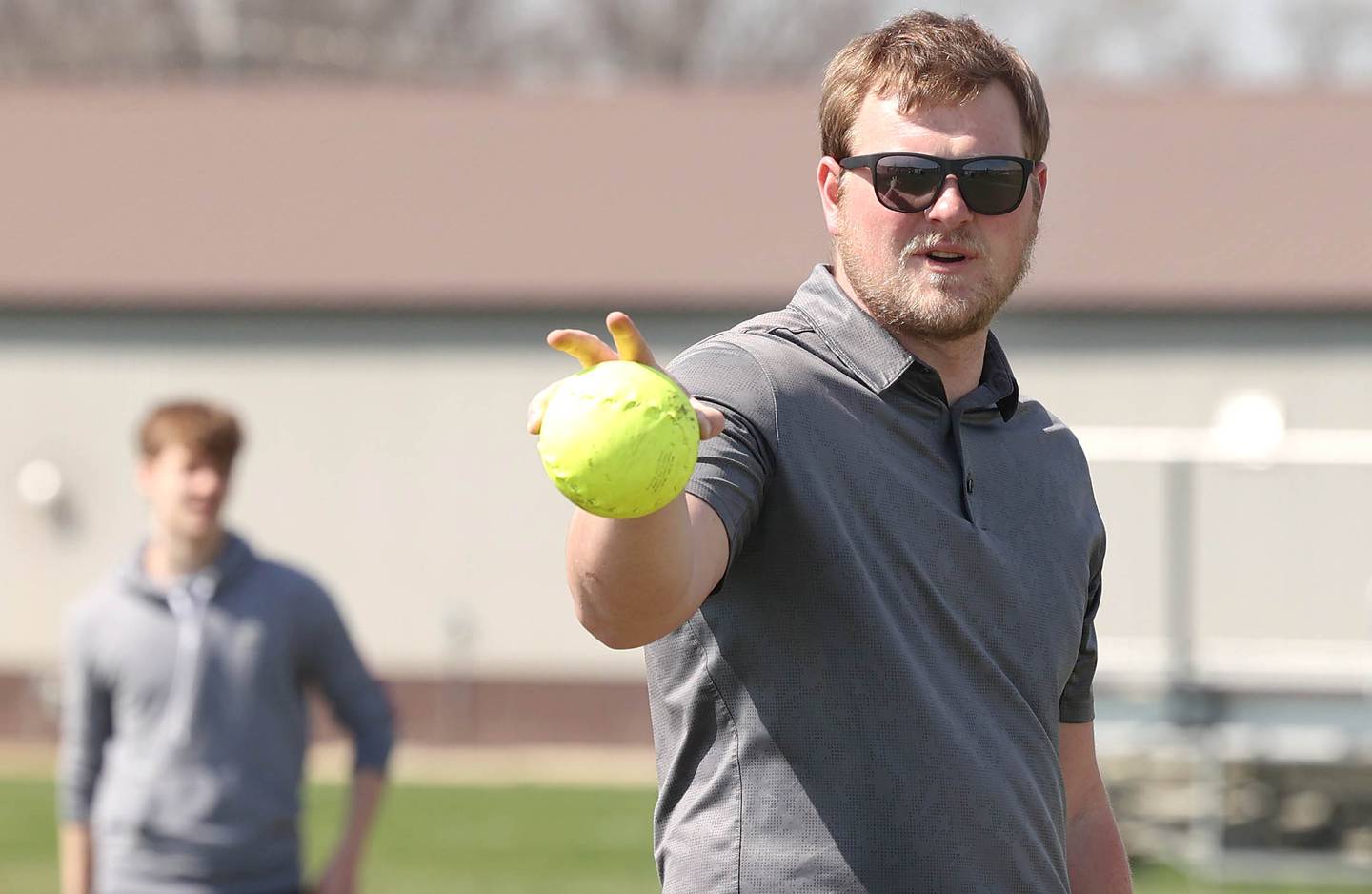 Griffin McNeal, Genoa-Kingston High School physical education teacher, makes teams for a softball game Thursday, April 13, 2023, during class at the school.
