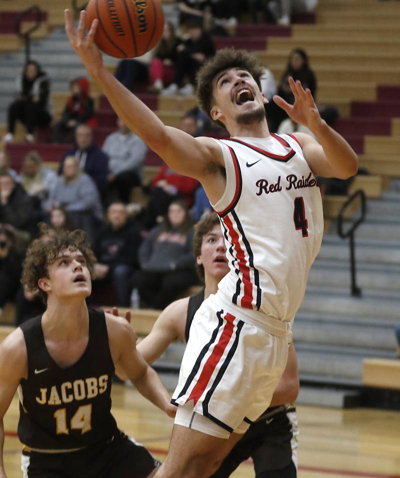 Huntley's Ian Ravagnie shoots the ball   in front of Jacobs' Brett Schlicker during a Fox Valley Conference boys basketball game Tuesday, Jan. 24, 2023, at Huntley High School.