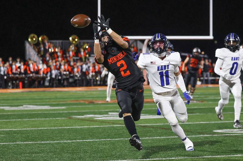 Minooka’s Ty Couch comes up short on the reception against Lincoln-Way East on Friday, Nov. 8, 2024 in Minooka.