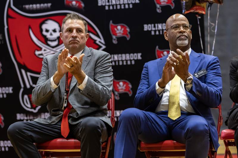 Principal Dr. Jason Pascavage and VVSD Superintendent Dr. Keith Wood applaud the student body at the surprise assembly during which Dr. Jaclyn Lennox, Bolingbrook High School’s assistant principal, was honored with the Milken Educator Award at Bolingbrook High School on Oct. 16, 2025.
