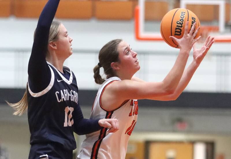 Cary-Grove’s Alivia Nelson, left, races Crystal Lake Central’s Samantha Pottorff for the ball in varsity girls basketball on Tuesday, Jan. 7, 2025, at Crystal Lake Central High School in Crystal Lake.