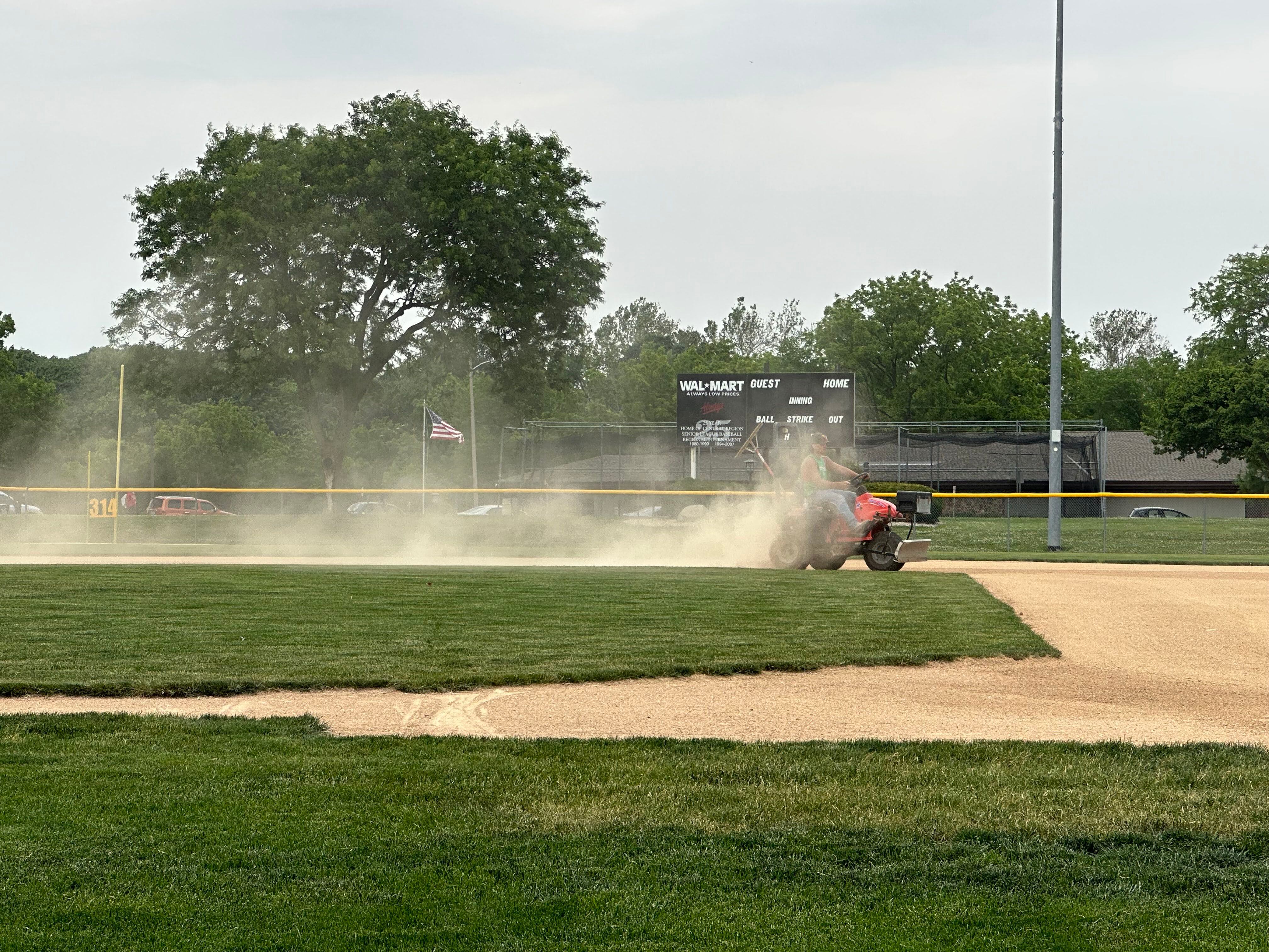 Peru city workers create a long trail of dust as they drag the infield of Washington Park on Wednesday, June 7, 2023, in Peru. 